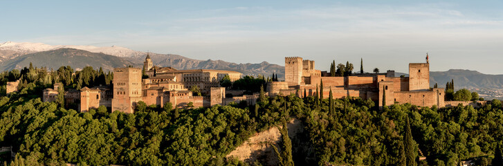 Fototapeta na wymiar Panoramic view of Alhambra in Granada with Sierra Nevada. Palacios Nazaríes, Palace of Charles V, Alcazaba. Andalusia, Spain