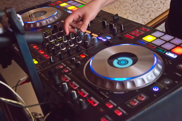 Professional concert dj turntables player device with sound mixer panel and jog wheel.Club disc...