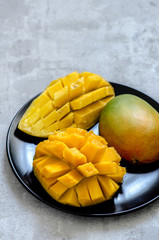 Fresh juicy mango cut on a plate