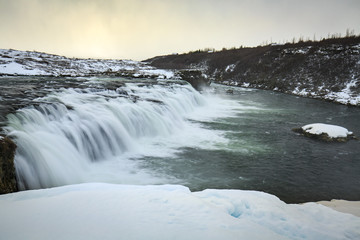Faxafoss waterfalls along the Golden Circle route in snowy Winter Iceland