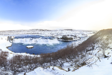 Faxafoss waterfalls along the Golden Circle route in snowy Winter Iceland