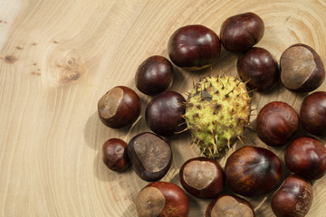 Group of chestnuts in a wooden background