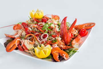 Lobster salad on white background, selective focus.Catalan lobster.