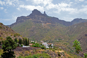Spain. Gran Canaria. Mountain landscape with a village under the Grand Rock