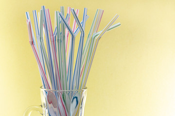 Plastic Straws in a Glass Cup