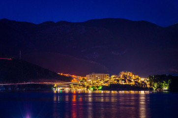 View on illuminated coastline at night in Budva, Montenegro