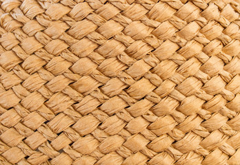The texture of the weave of straw. Seamless background for design