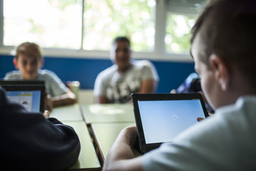 children study in class with their tablet