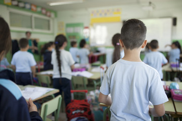 children listening to the teacher's explanation