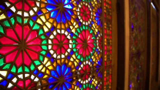 A moving shot inside a the wind tower. Patterns are attached to its wall.
