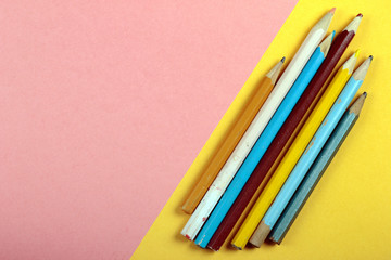 Summer fun minimal concept. Top view on pencil colors. Drawing. Pastel colours background. Flat lay, mock up and copy space. Trendy colors.