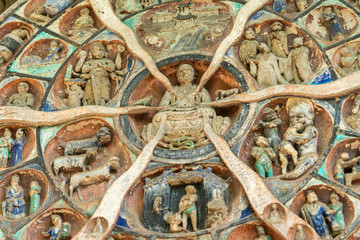 The Buddha statue, carved in six samsara styles, is located in dazu stone carving in chongqing,...