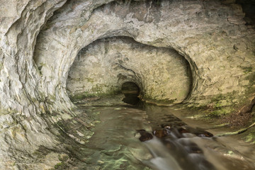 The outlet of Cave Stream, also known as Broken River Cave, situated in Canterbury, New Zealand.