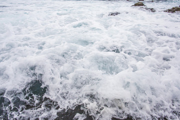 Ocean wavy surface close up. sae water texture background, motion blur. .Tenerife, Puerto De La Cruz.