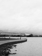 Man walking alone on waterfront