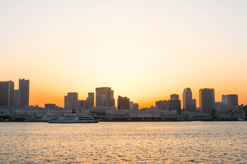 Fototapeta na wymiar Landscape View of sunset and one boat at sumida river viewpoint to see boats in tokyo
