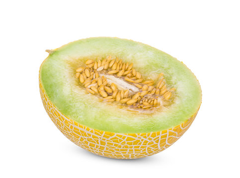 half pearl orange melon with seeds isolated on white background