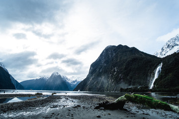 A stunning scene of nature with snow mountain and ford land at Milford Sound, New Zealand.