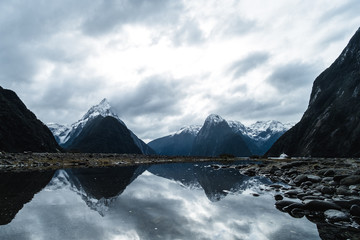 A stunning scene of nature with snow mountain and ford land at Milford Sound, New Zealand.