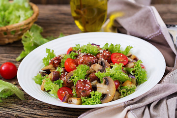 Salad with meatballs, eggplant, mushrooms and tomatoes in Asian style. Healthy food. Diet meal.
