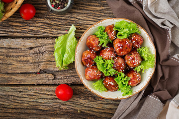 Meatballs with beef in sweet and sour sauce. Asian food. Top view. Flat lay