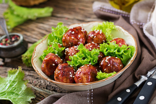 Meatballs with beef in sweet and sour sauce. Asian food.