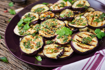Eggplant grilled with balsamic sauce, garlic, cilantro and mint. Vegan food. Grilled aubergine.