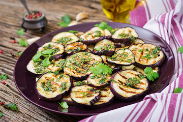 Eggplant grilled with balsamic sauce, garlic, cilantro and mint. Vegan food. Grilled aubergine.