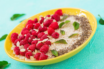 Tasty and healthy oatmeal porridge with raspberry and flax chia. Healthy breakfast. Fitness food. Proper nutrition