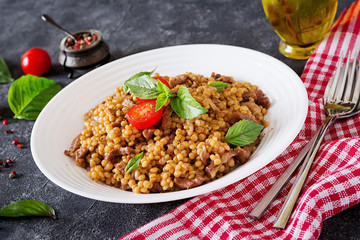 Israeli couscous with beef. Tasty food. Asian meal.