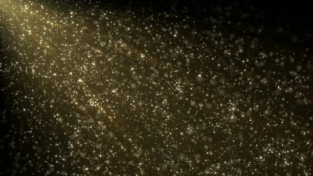 Gold glitter or dust. Loop-able between 10:00 to 20:00. Particles floating with gentle movement, illuminated in a beam of light shining from top left. Defocused bokeh effect.