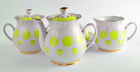 A set of rare ceramic teapots, sugar bowls on a white background.