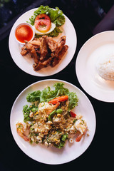Fried chicken wings with salt served with chili sauce and Shrimp stir fried with bitter bean and vermicelli.