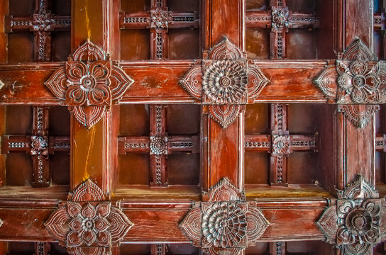 Wooden Handicraft Design Pattern. Traditional Woodwork On The Ceiling Of Old Building In Kerala, India.