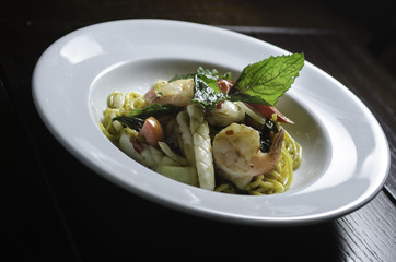 Seafood spagetti on white plate