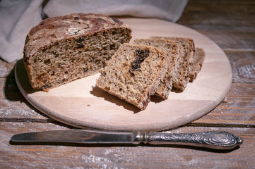 Homemade rye bread on rustic background. Organic food.