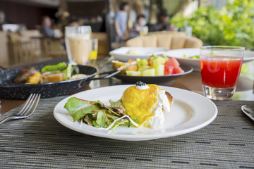 Delicious egg Benedict on the restaurant table