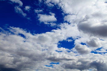 Clouds on a blue sky as a background
