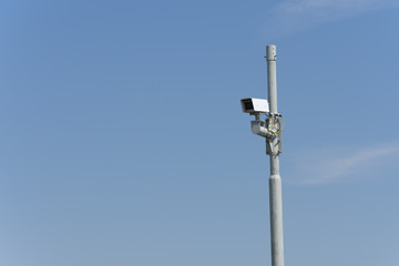 security camera high fastened to a pole