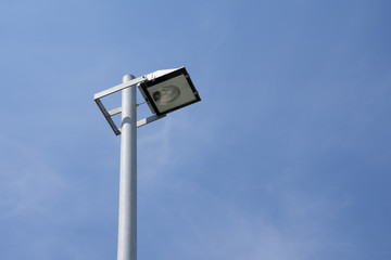 tight Street lamp with a light cloudy blue sky