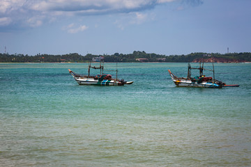 Fototapeta na wymiar MIRISA, SRI LANKA-APRIL 20: Boats April 20, 2018 in Mirisa, Sri Lanka. Fishermans boats
