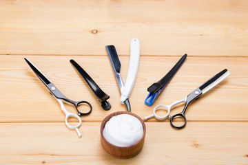 set of tools for cutting men, on a wooden background, for shaving hair