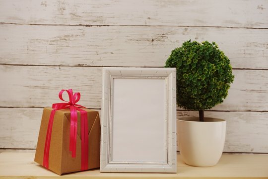 photo frame with gift box present and home decoration
