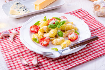 delicious gnocchi with gorgonzola cream sauce and cherry tomatoes