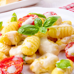 delicious gnocchi with gorgonzola cream sauce and cherry tomatoes