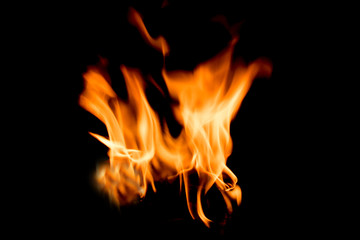 There is a fire in the background.