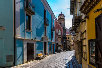 MARATEA, POTENZA, ITALY - A narrow street (Via dell'Unità d'Italia) overlooking the Catholic Church (Chiesa dell'Annunziata) in the old town of Maratea on the coast in the south of Italy.