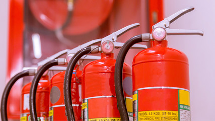 Red tank of fire extinguisher Overview of a powerful industrial fire extinguishing system. - obrazy, fototapety, plakaty