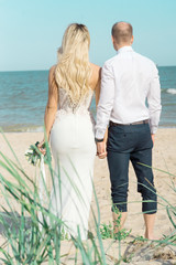 bride and groom on the beach