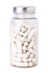 White capsules in middle size transparent plastic bottle  isolated on white background. Natural...